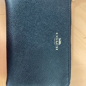 Coach wristlet. New in sealed package.